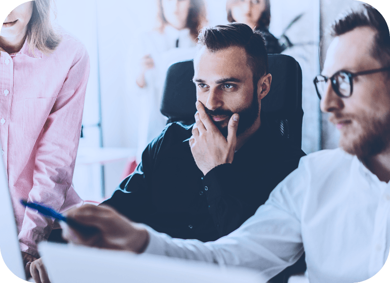 A team looking at screen and considering to become partners with Nemetschek Bulgaria. 